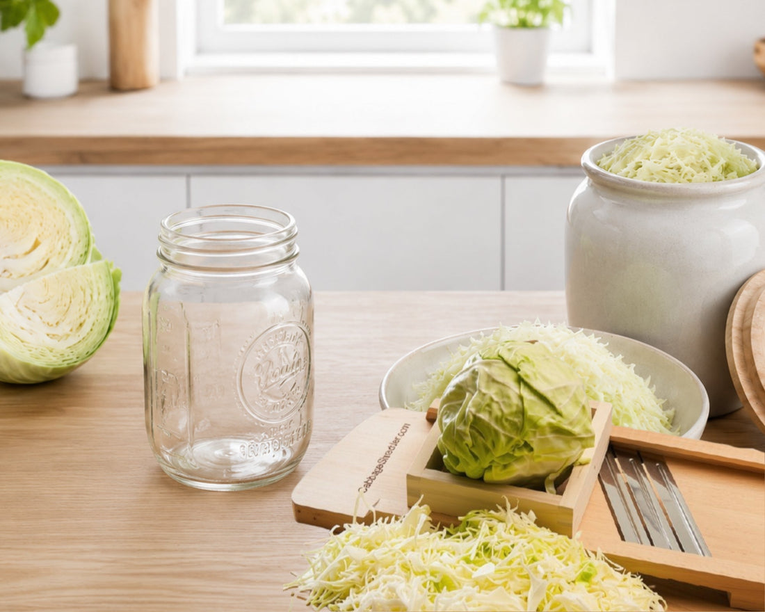 Fresh cabbage, shredded cabbage, and homemade sauerkraut in a bright modern kitchen